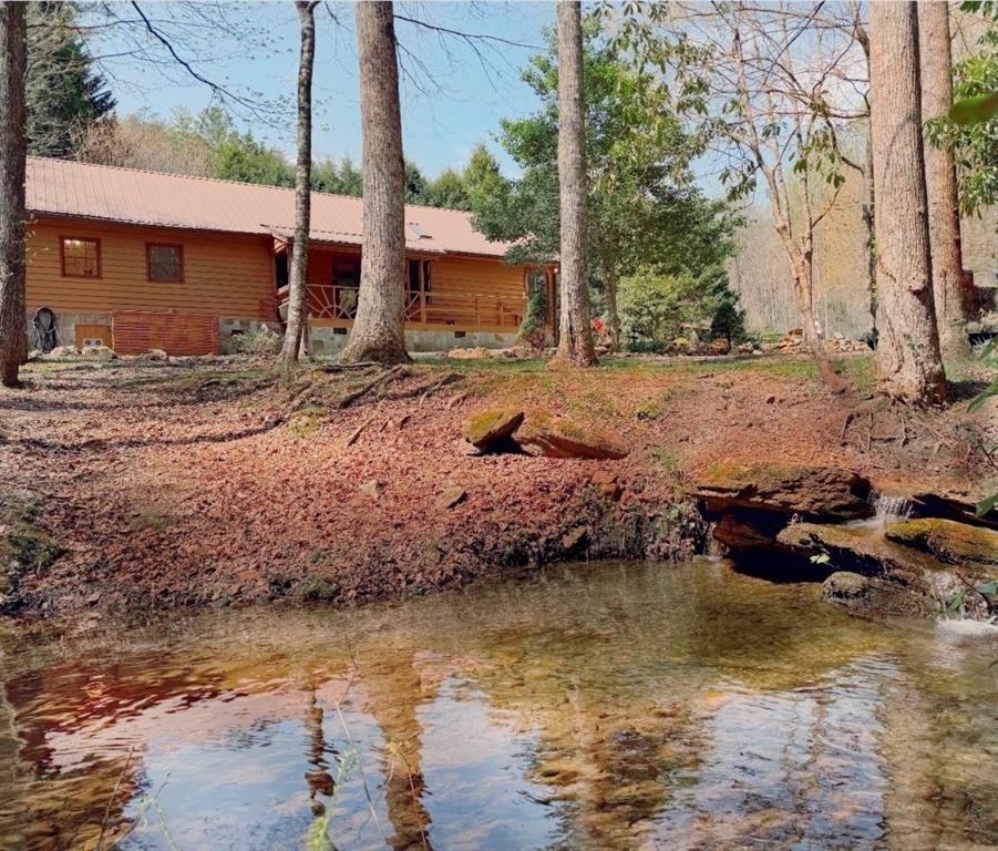 2889 Old Parker Pl Road Ellijay, GA 30536 - Photo 8 of 59 a backyard of a house with lots of green space