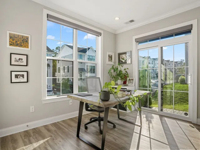 a workspace with furniture and a window