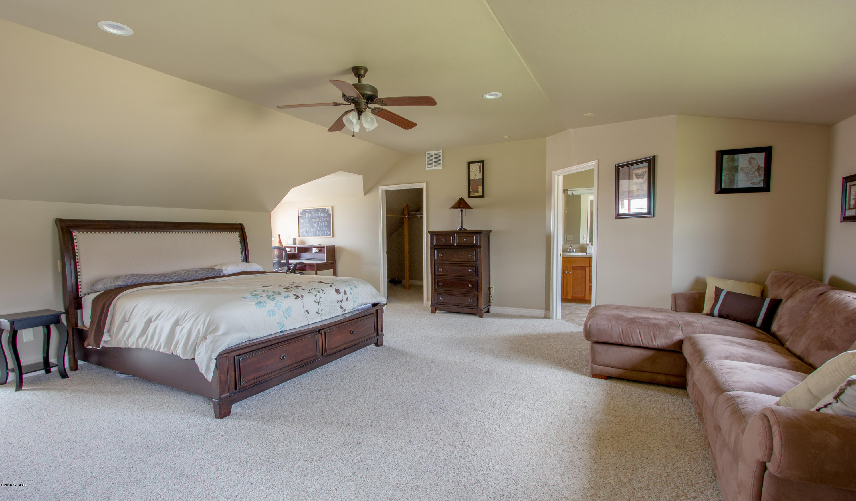 491 Section 1 Road Tieton, WA 98947 - Photo 15 of 23 a spacious bedroom with a bed couch and window