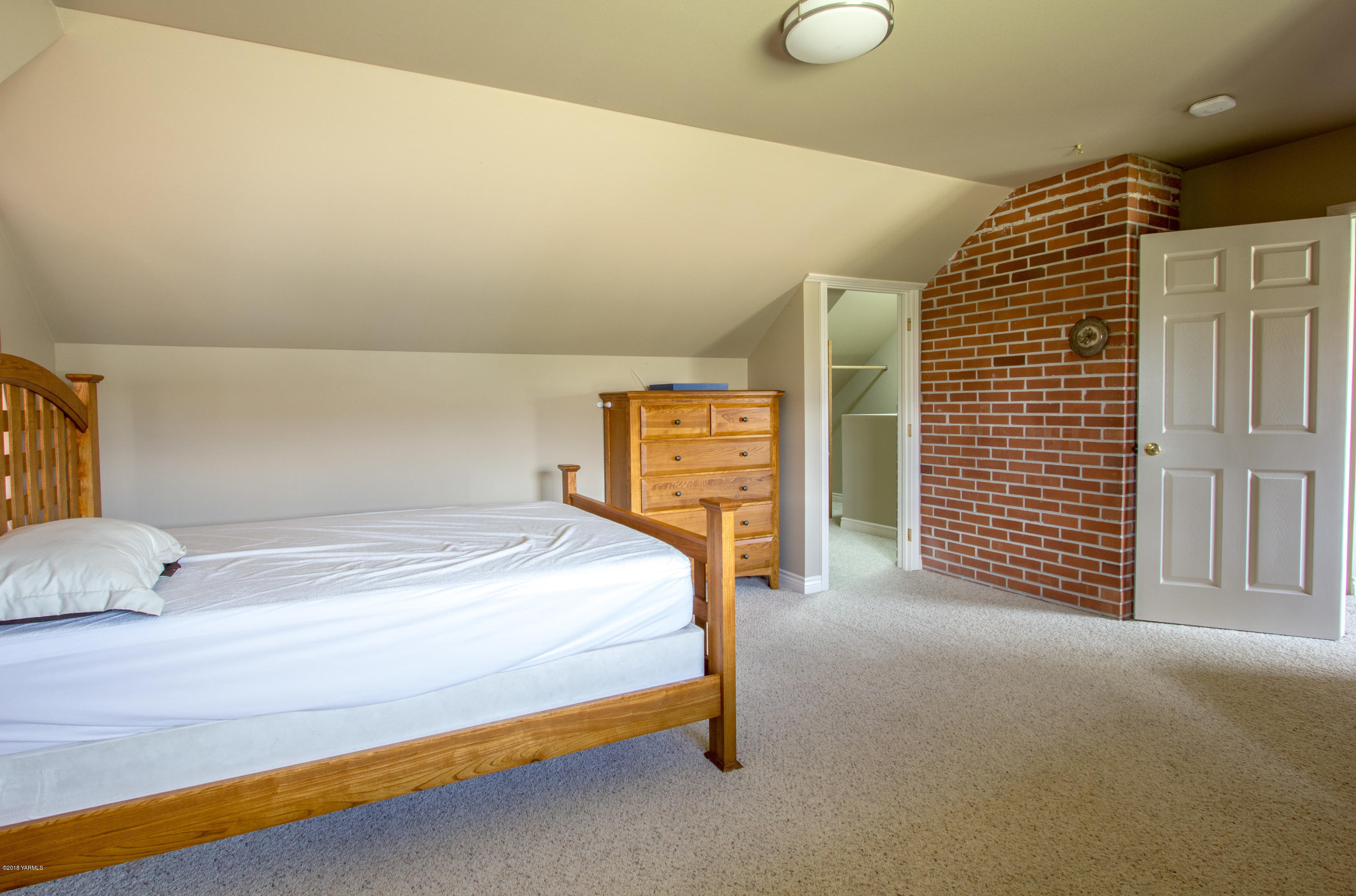 491 Section 1 Road Tieton, WA 98947 - Photo 19 of 23 a bedroom with a bed and cabinets