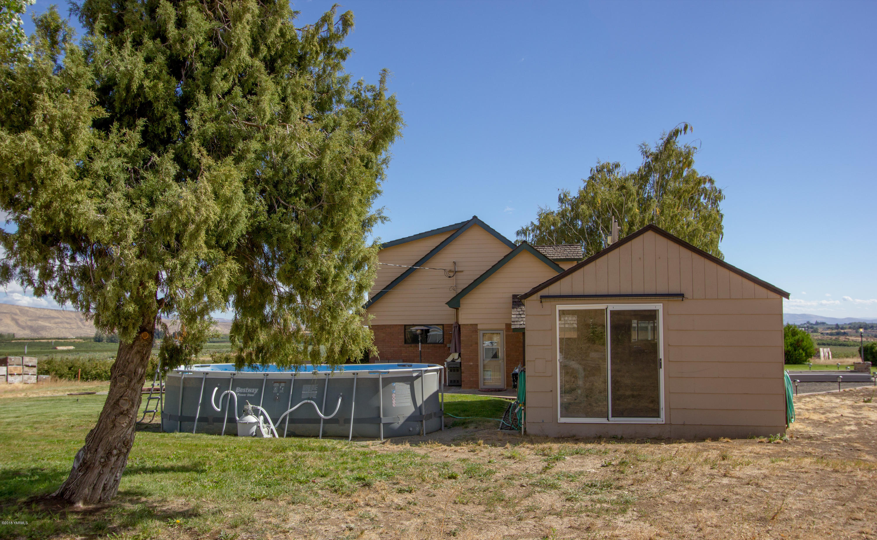 491 Section 1 Road Tieton, WA 98947 - Photo 4 of 23 a front view of a house with a yard and garage