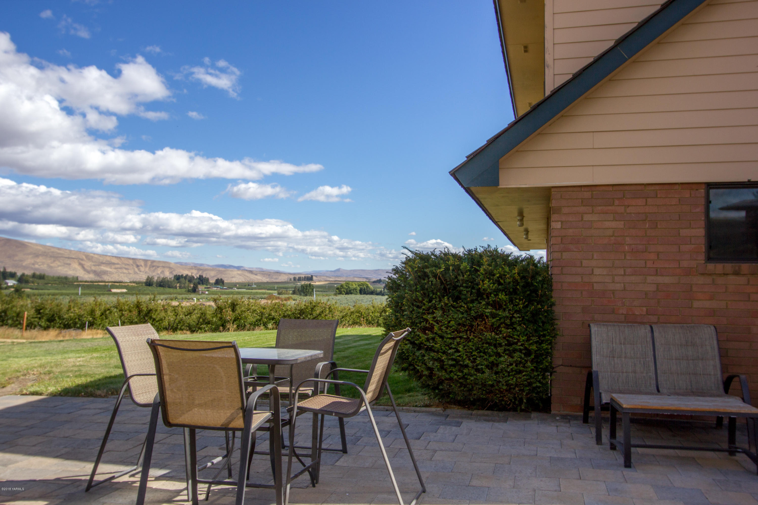 491 Section 1 Road Tieton, WA 98947 - Photo 5 of 23 a patio with wooden floor and outdoor seating