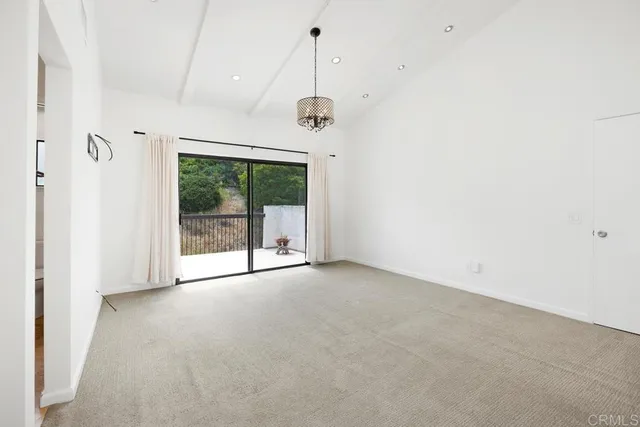 a view of an empty room with glass door