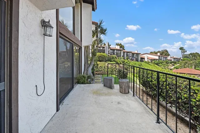 a view of a balcony with city view