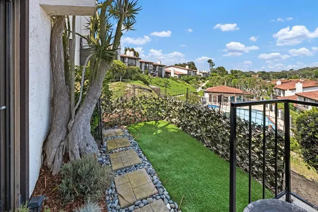 a view of a yard and front view of a house