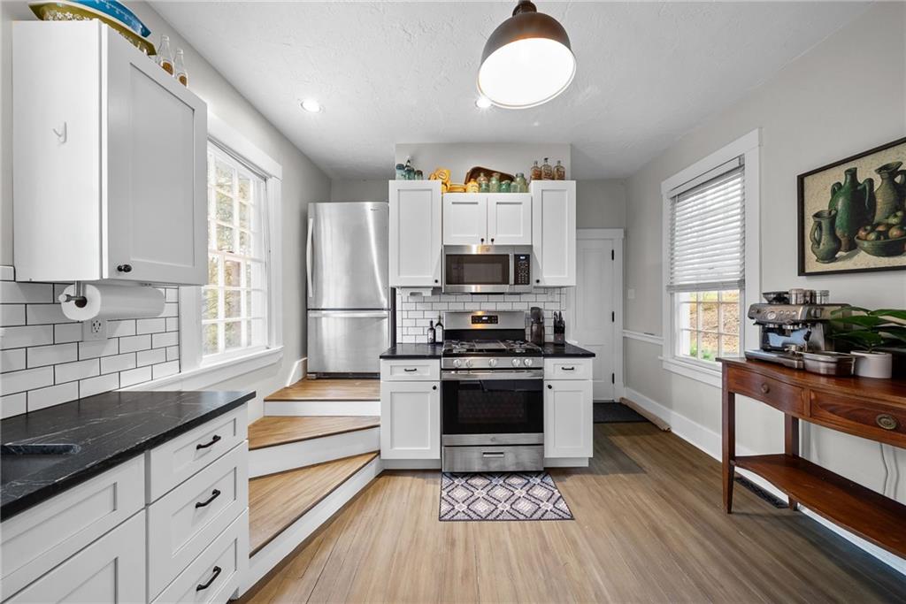 755 South Main Street Washington, PA 15301 - Photo 12 of 44 a kitchen with stainless steel appliances a stove sink and refrigerator