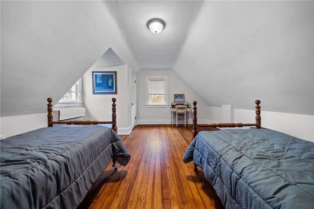 755 South Main Street Washington, PA 15301 - Photo 35 of 44 a spacious bedroom with a bed and wooden floor