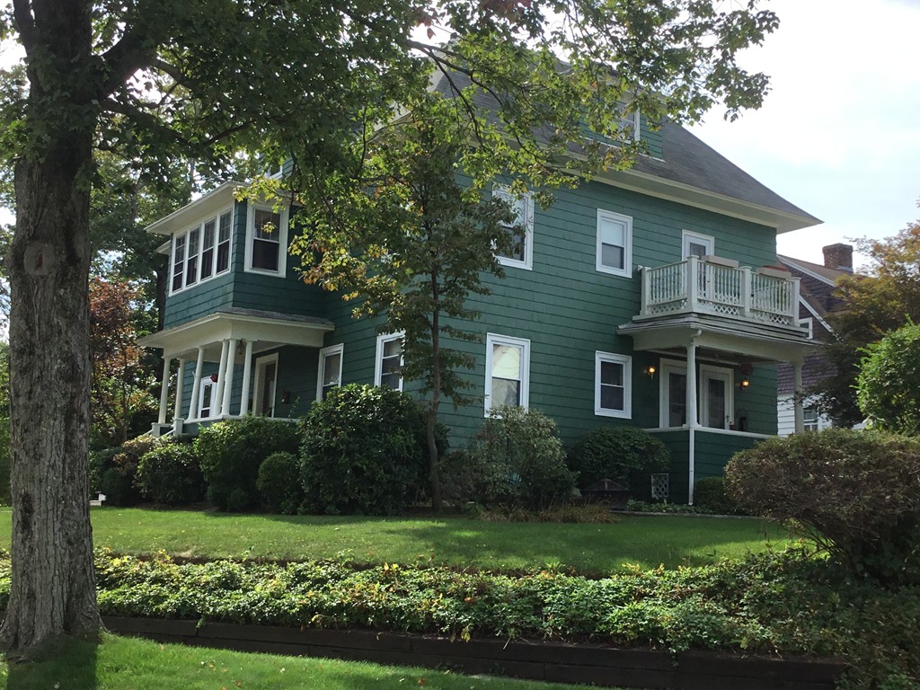 53 Brighton Road Worcester, MA 01606 - Photo 3 of 22 a front view of a house with a yard and green space