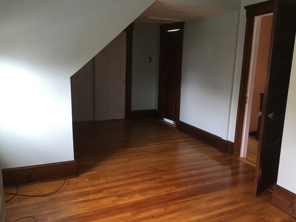 53 Brighton Road Worcester, MA 01606 - Photo 9 of 22 a view of a hallway with wooden floor