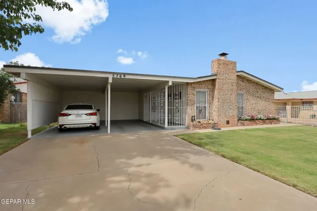 a car parked in front of a house