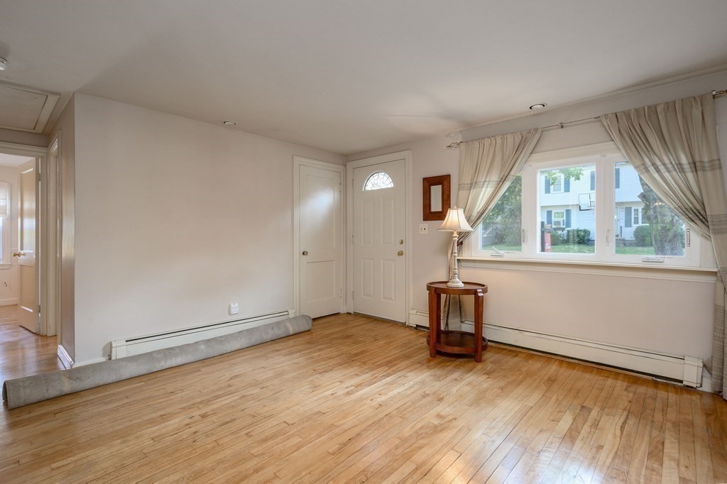 34 Clapp Street Abington, MA 02351 - Photo 11 of 21 wooden floor in an empty room with a window