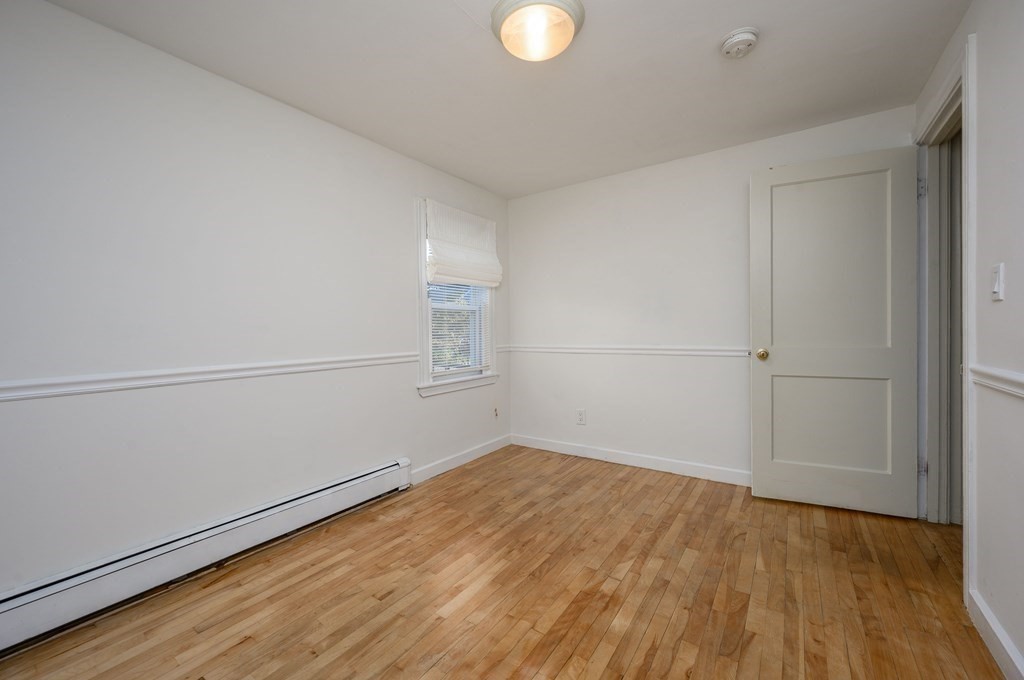 34 Clapp Street Abington, MA 02351 - Photo 13 of 21 a view of empty room with wooden floor