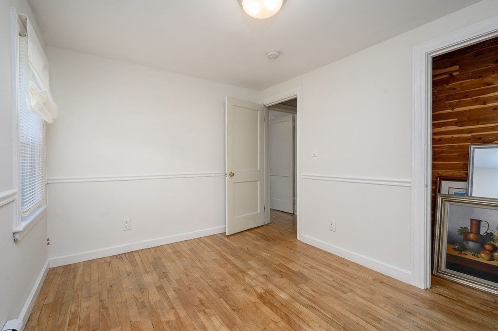 34 Clapp Street Abington, MA 02351 - Photo 14 of 21 an empty room with wooden floor