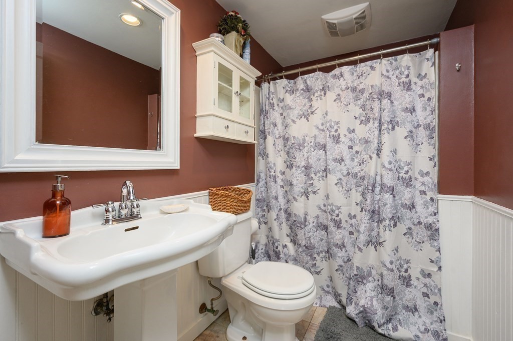 34 Clapp Street Abington, MA 02351 - Photo 15 of 21 a bathroom with a sink toilet and mirror