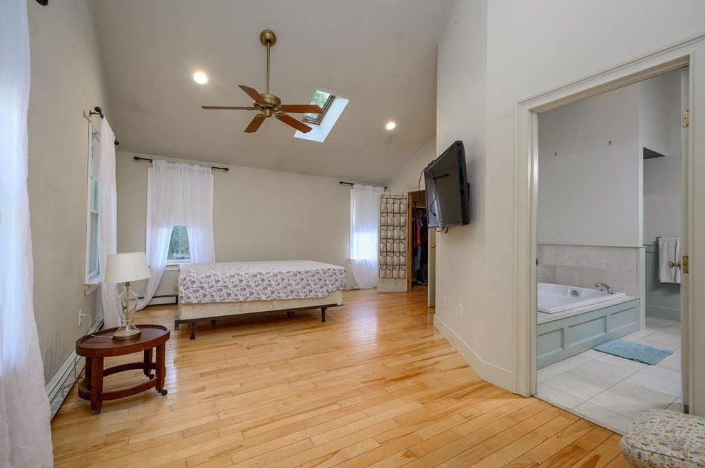 34 Clapp Street Abington, MA 02351 - Photo 16 of 21 a bedroom with a bed and wooden floor