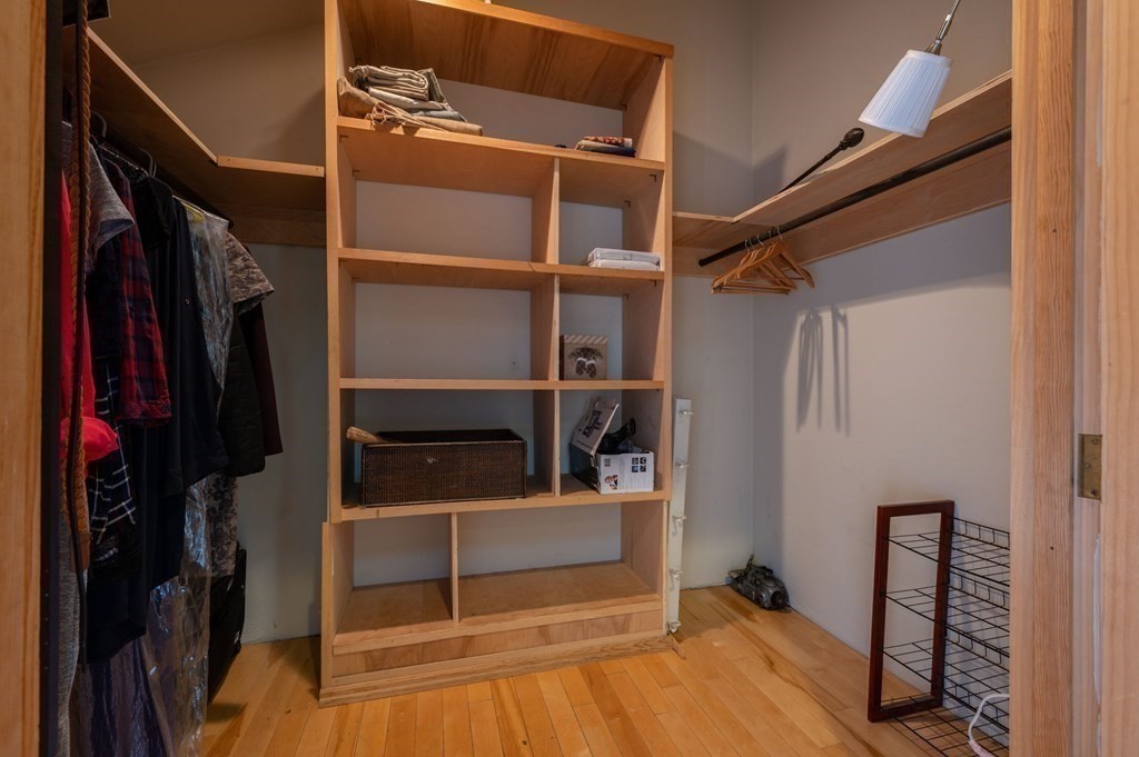 34 Clapp Street Abington, MA 02351 - Photo 18 of 21 a view of walk in closet with clothes and shoes
