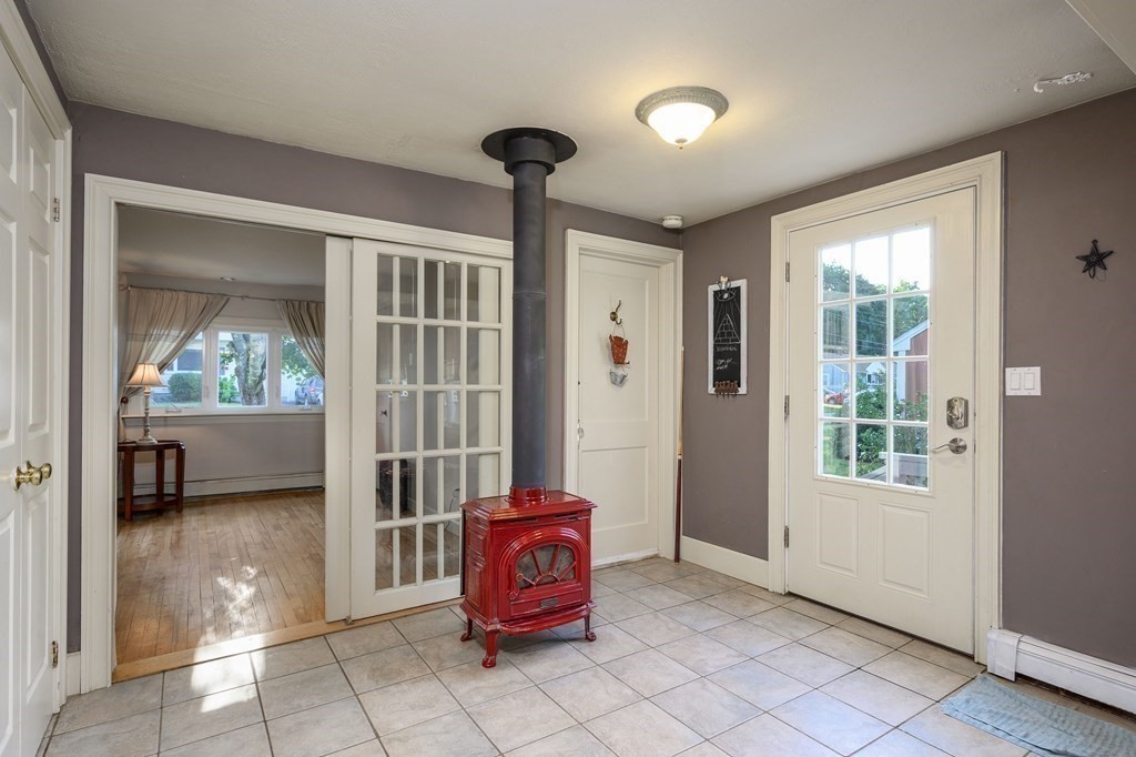 34 Clapp Street Abington, MA 02351 - Photo 3 of 21 a living room with furniture a window and a chandelier