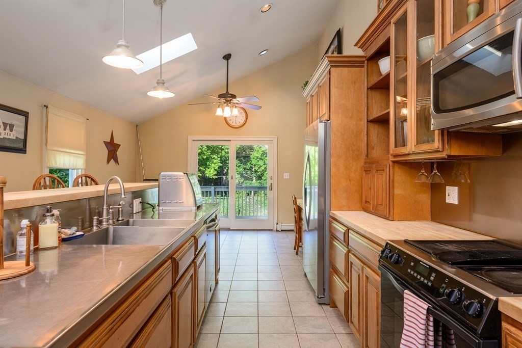34 Clapp Street Abington, MA 02351 - Photo 5 of 21 a kitchen with sink stove and cabinets