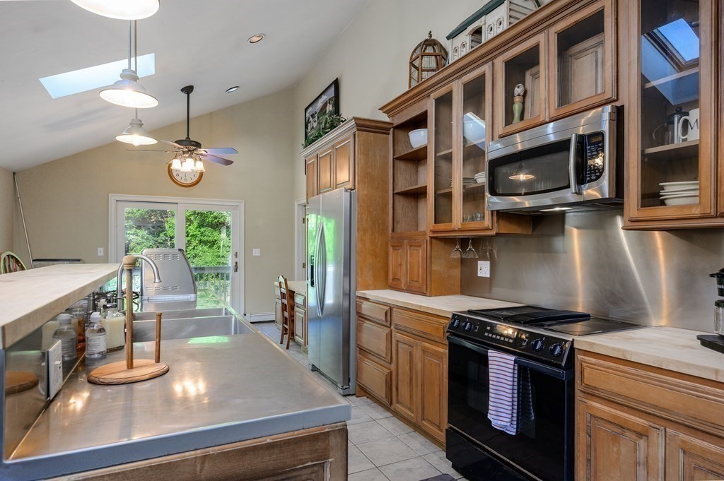 34 Clapp Street Abington, MA 02351 - Photo 6 of 21 a kitchen with a stove and a wooden floors