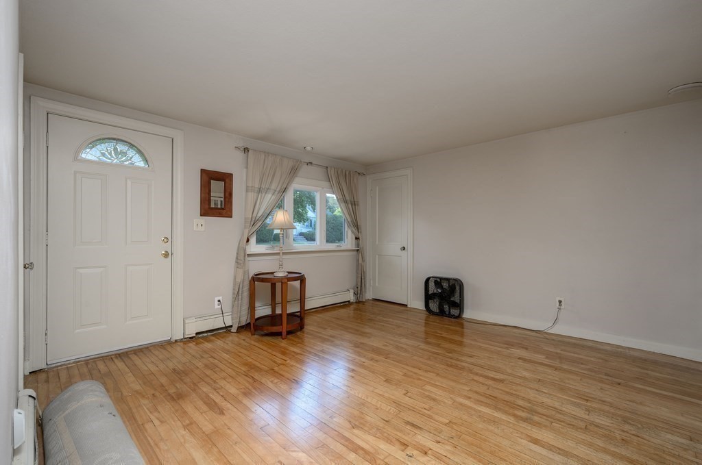 34 Clapp Street Abington, MA 02351 - Photo 10 of 21 a view of a livingroom with wooden floor and a window