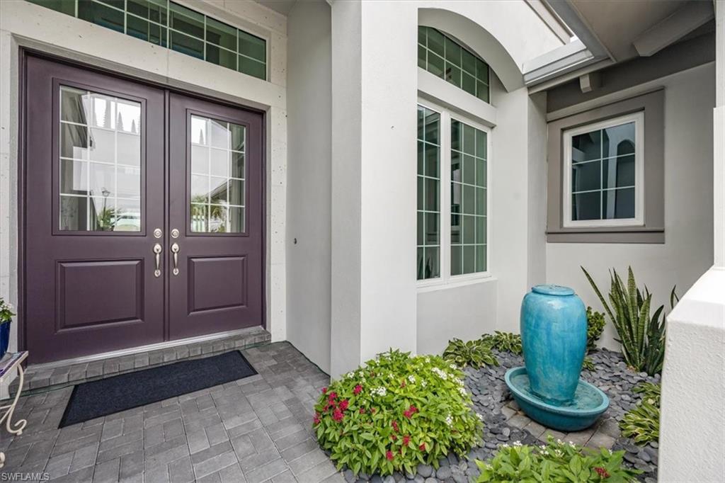 6257 Negril Isle Drive Naples, FL 34113 - Photo 7 of 47 Welcoming double door entrance