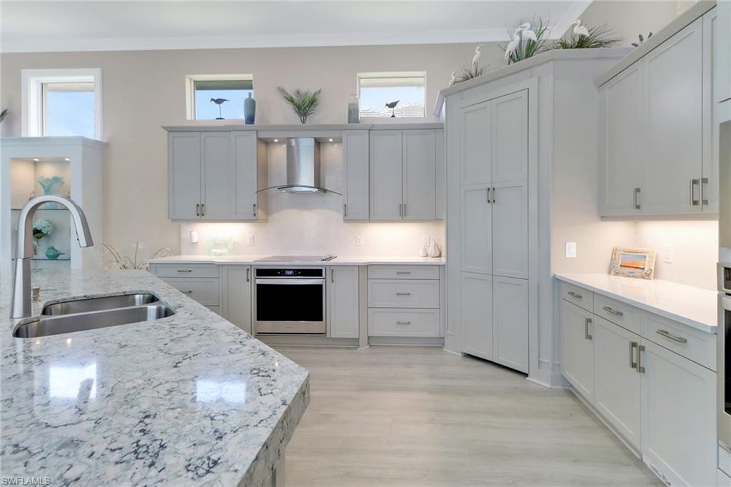 6257 Negril Isle Drive Naples, FL 34113 - Photo 10 of 47 Kitchen Quartz countertops