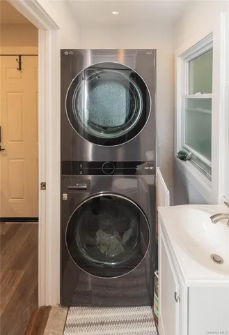 a utility room with sink dryer and washer