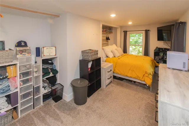 a bedroom with a bed and furniture