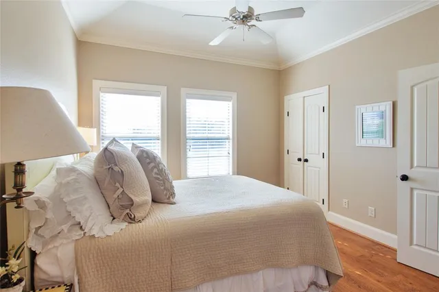 a bedroom with a large bed and a window