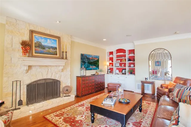 a living room with furniture fireplace and window