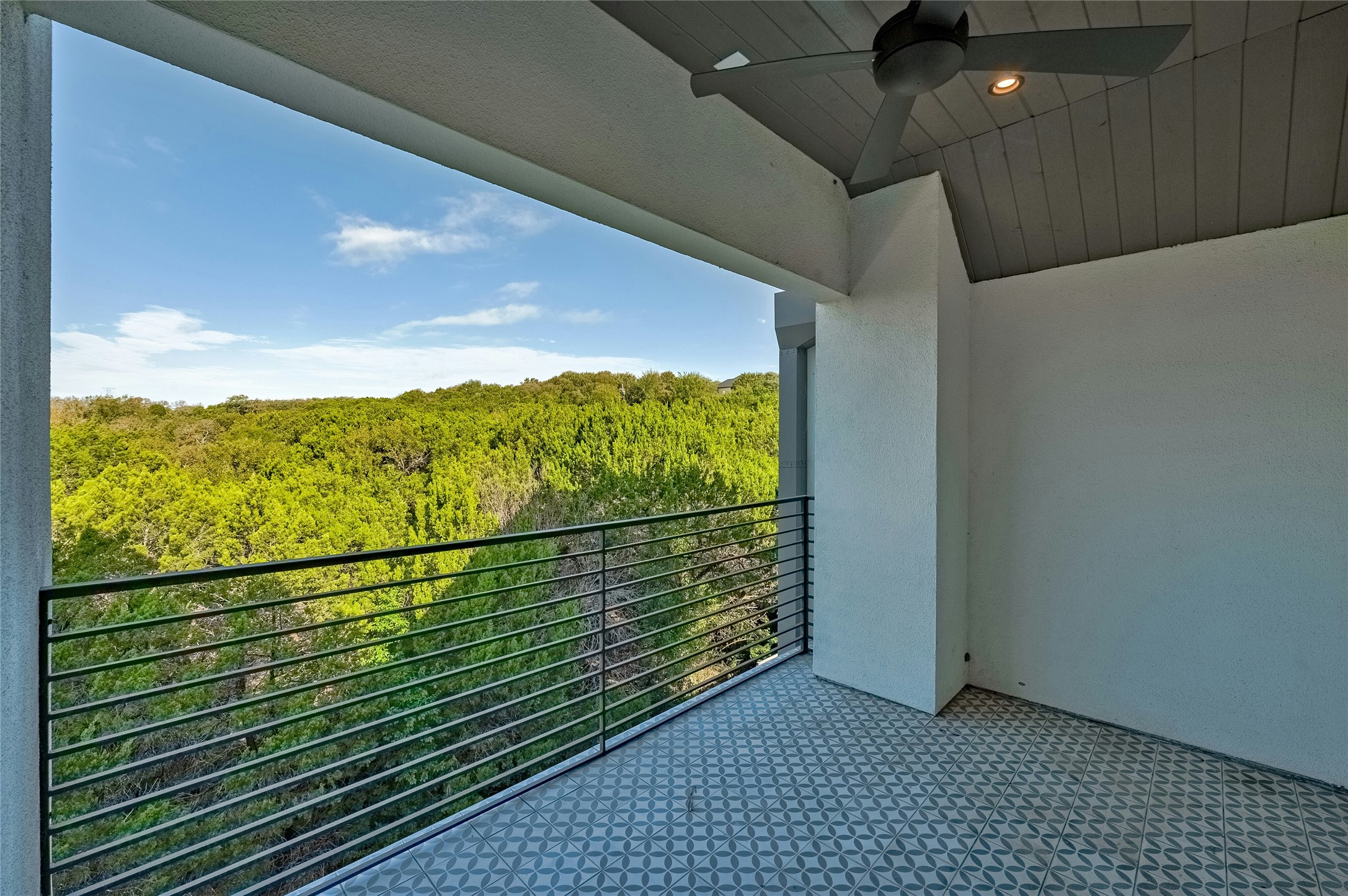 2518 Sutherland Street Austin, TX 78746 - Photo 21 of 30 A tranquil balcony provides verdant views over the surrounding natural landscape, perfect for serene outdoor living.