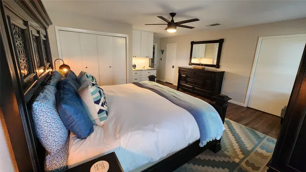 a bathroom with a granite countertop sink and mirror