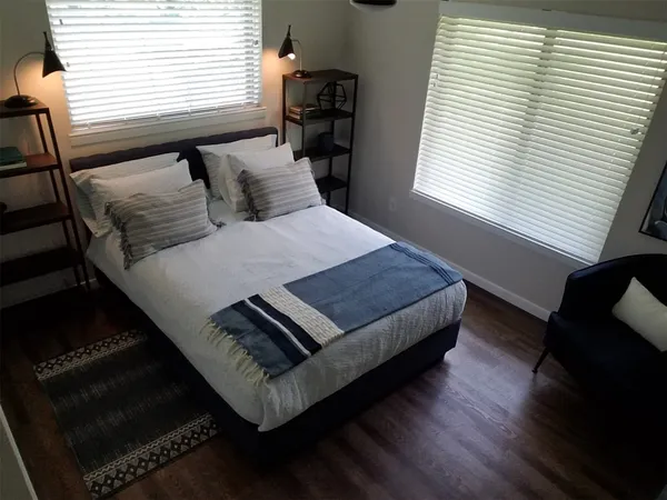 a view of kitchen with stainless steel appliances granite countertop lots of counter top space