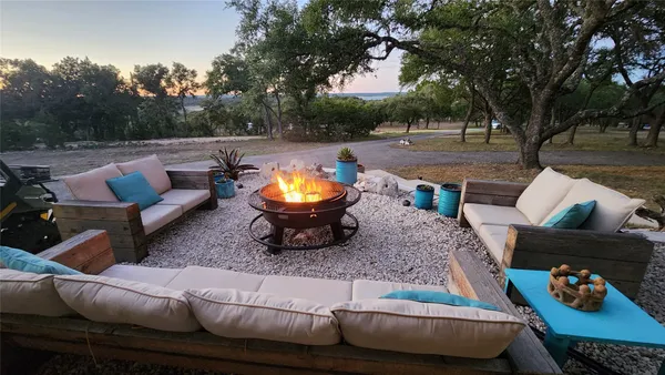 a living room with fireplace furniture and a flat screen tv