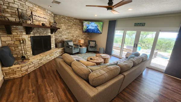 a living room with furniture fireplace and a flat screen tv