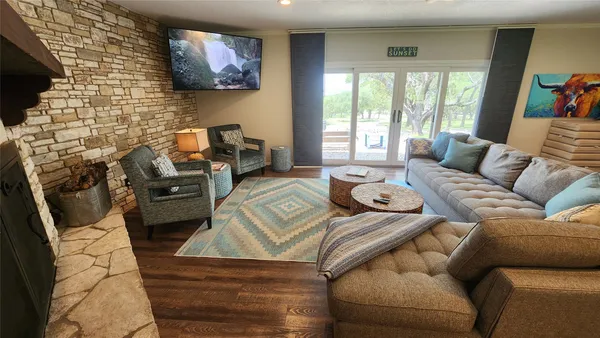 a kitchen with stainless steel appliances granite countertop a stove refrigerator sink and cabinets