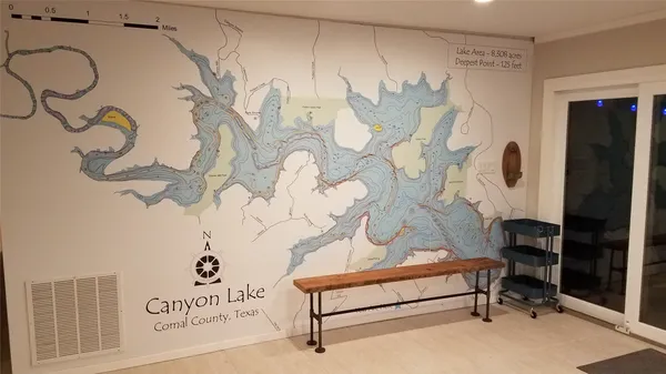 a kitchen with a granite countertop sink and a window