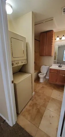 a living room with furniture and a mirror