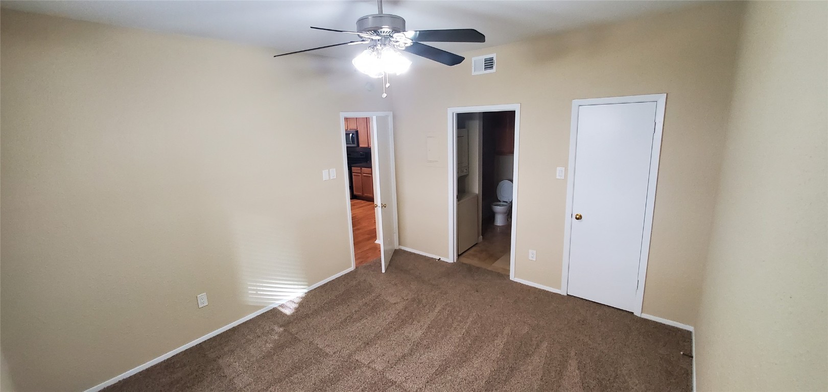 114 East 31st Street, Unit 114 Austin, TX 78705 - Photo 7 of 11 a view of an empty room with a ceiling fan