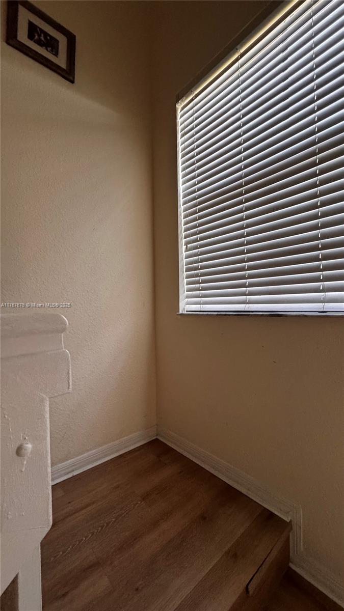 1033 Southwest 144th Avenue, Unit 2705 Pembroke Pines, FL 33027 - Photo 15 of 28 a view of a room with wooden floor and a window