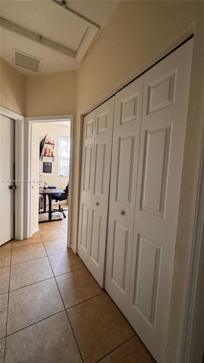 1033 Southwest 144th Avenue, Unit 2705 Pembroke Pines, FL 33027 - Photo 18 of 28 a view of a hallway with a furniture