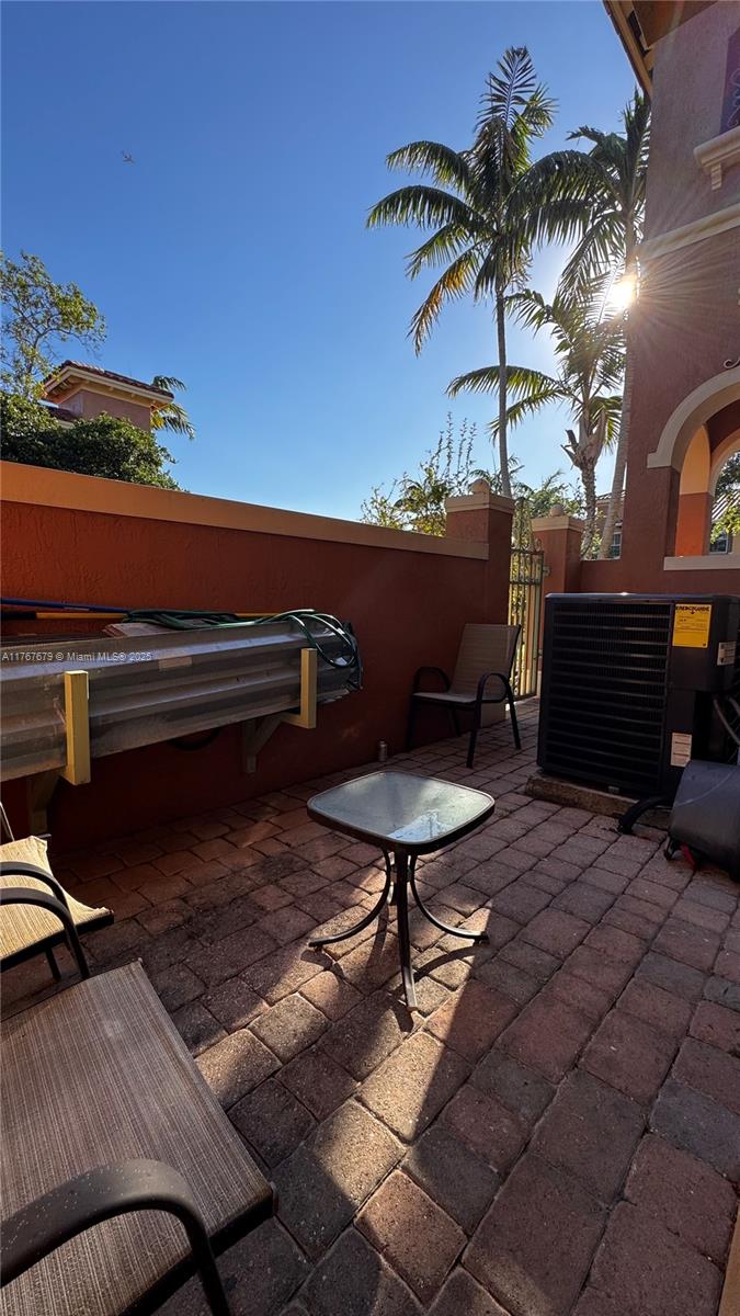1033 Southwest 144th Avenue, Unit 2705 Pembroke Pines, FL 33027 - Photo 28 of 28 a view of a terrace with furniture
