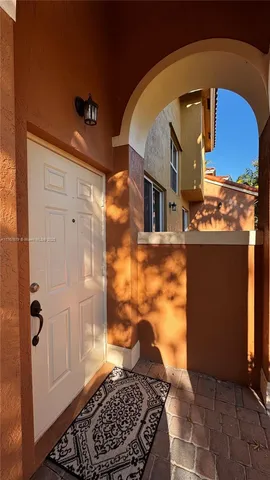 a bathroom with a glass door shower and a sink