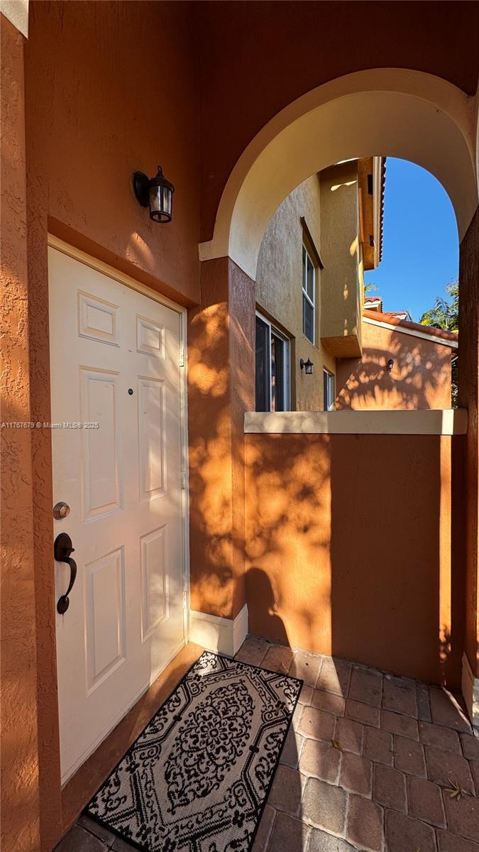 1033 Southwest 144th Avenue, Unit 2705 Pembroke Pines, FL 33027 - Photo 3 of 28 a bathroom with a glass door shower and a sink