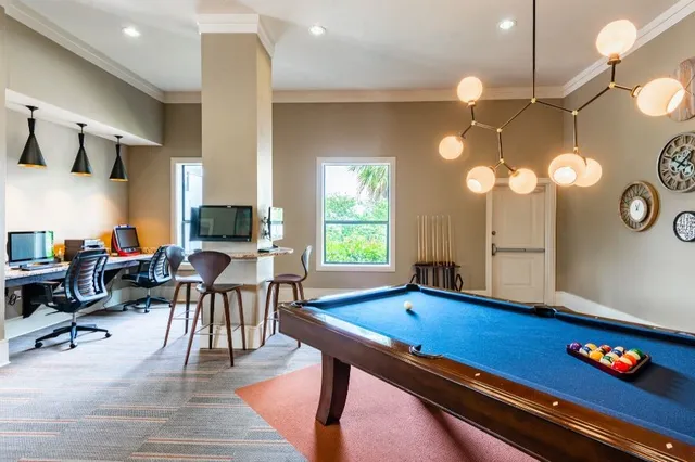 a view of swimming pool with outdoor seating and plants