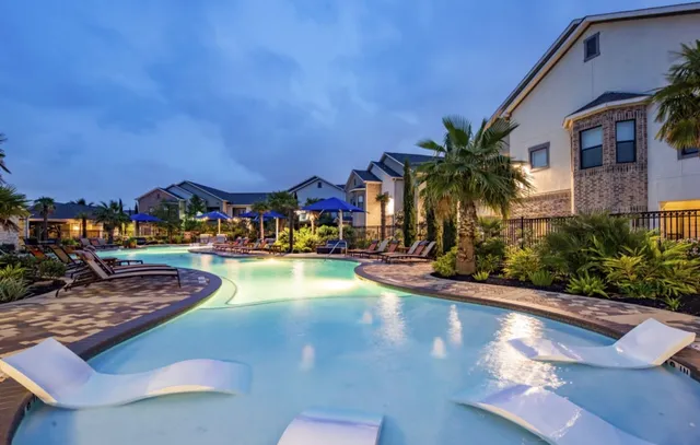 a kitchen with a refrigerator and a sink