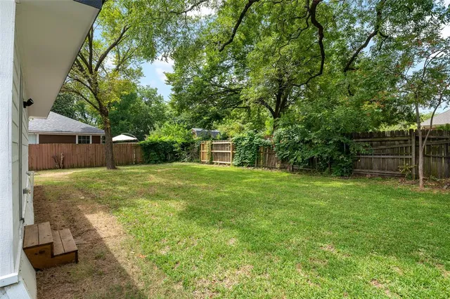 a view of a backyard with a garden