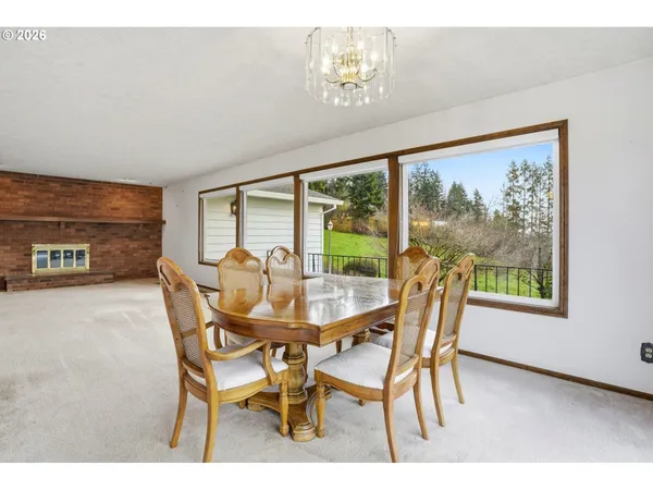 a view of a dining room with furniture window and outside view