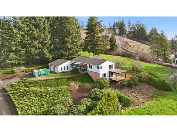 a view of house with a yard