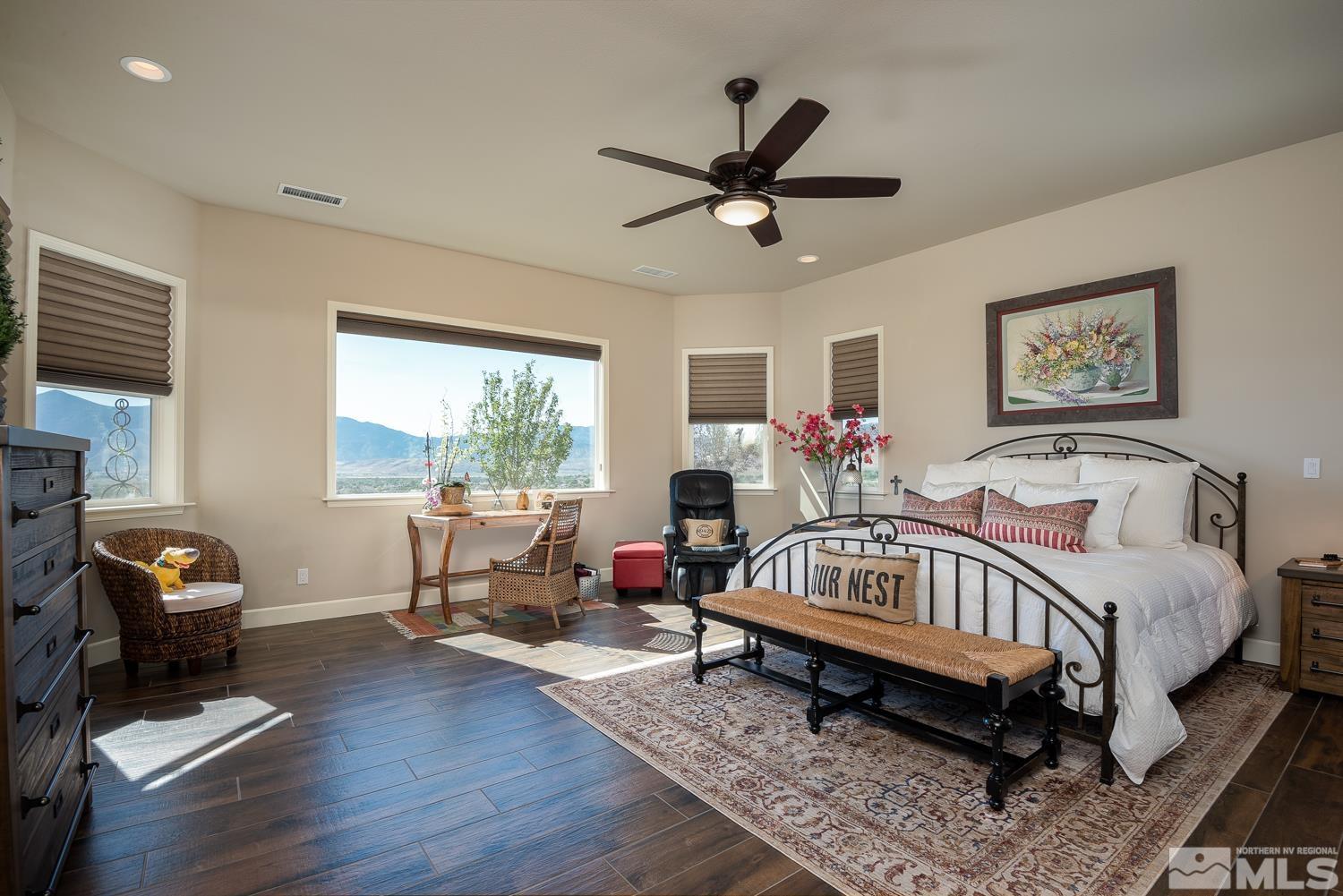 Undisclosed Address Minden, NV 89423 - Photo 14 of 33 a bedroom with a bed and wooden floor